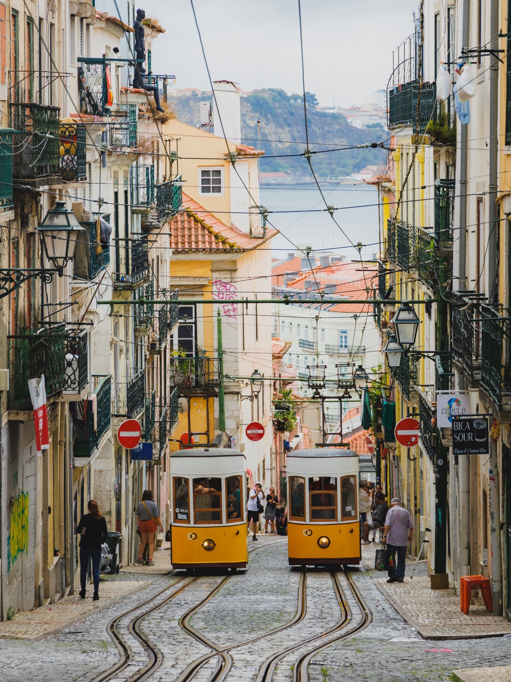 Yellow trams on the Bica street in Lisbon